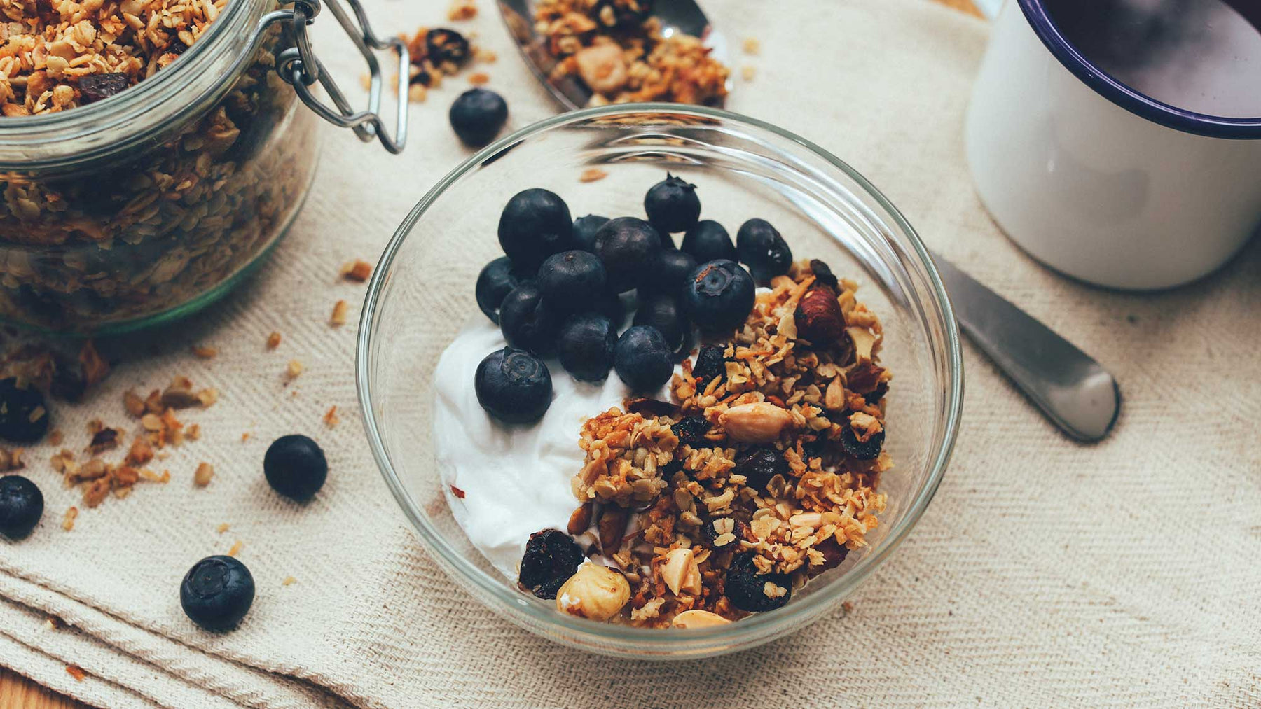 bowl of granola with yoghurt and blueberries 